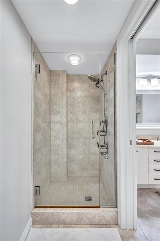 5880 Midnight Pass Road, Unit 306 Sarasota, FL 34242 - Photo 38 of 71 a bathroom with a shower
