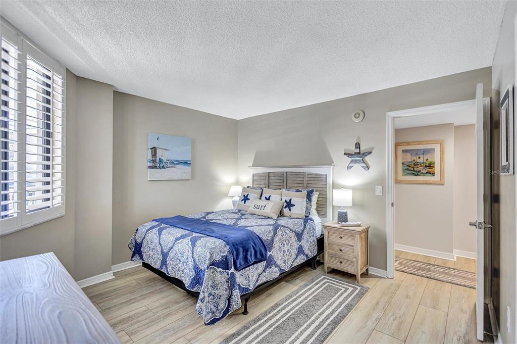 5880 Midnight Pass Road, Unit 306 Sarasota, FL 34242 - Photo 39 of 71 a bedroom with a bed and a window