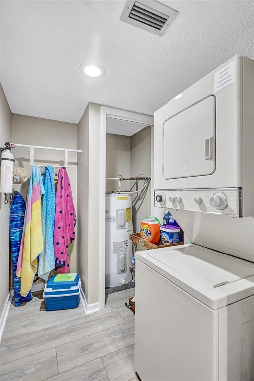 5880 Midnight Pass Road, Unit 306 Sarasota, FL 34242 - Photo 43 of 71 a utility room with dryer and washer