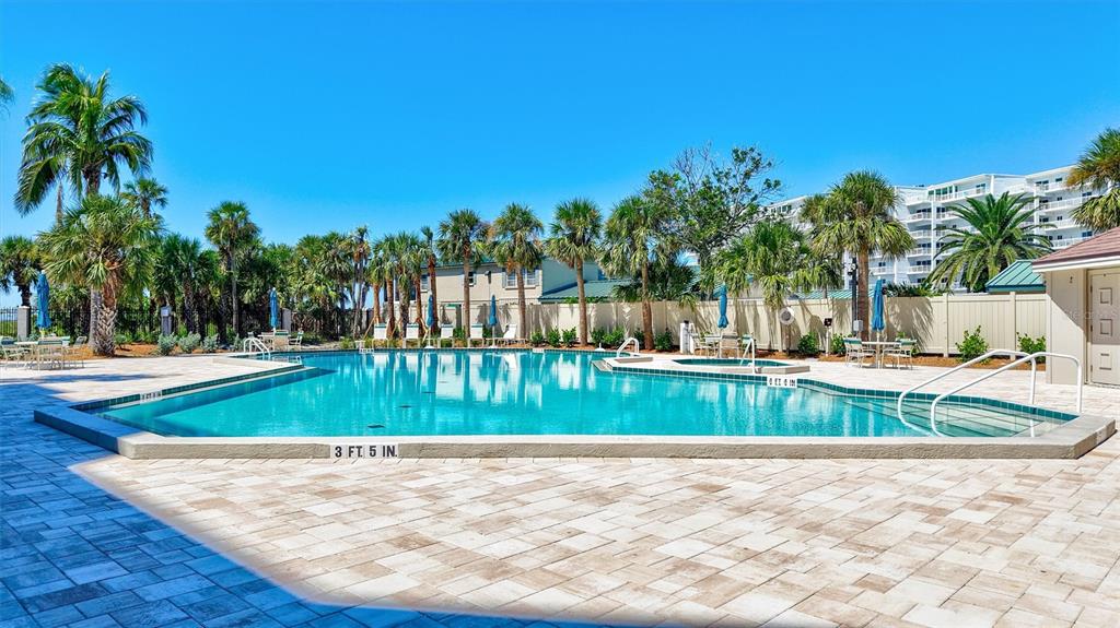 5880 Midnight Pass Road, Unit 306 Sarasota, FL 34242 - Photo 54 of 71 a view of backyard with swimming pool and seating space