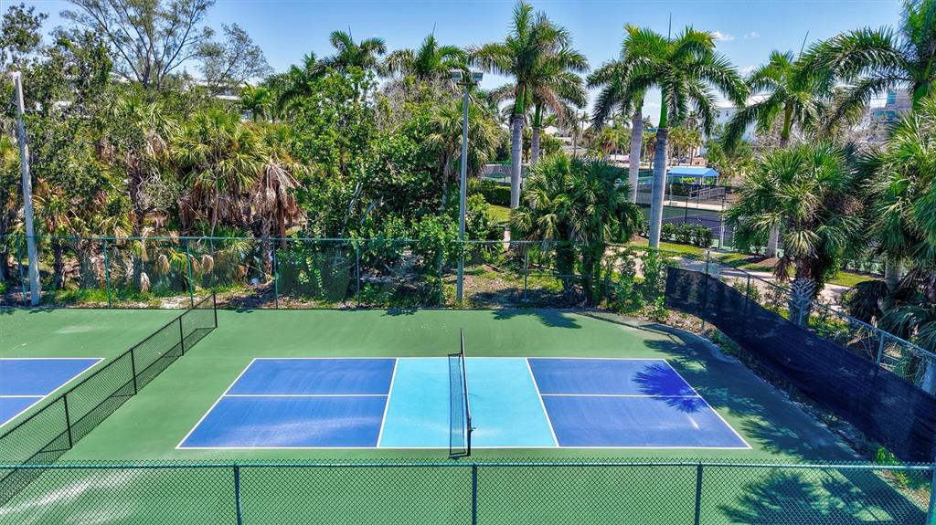 5880 Midnight Pass Road, Unit 306 Sarasota, FL 34242 - Photo 68 of 71 a view of yard with swimming pool and green space