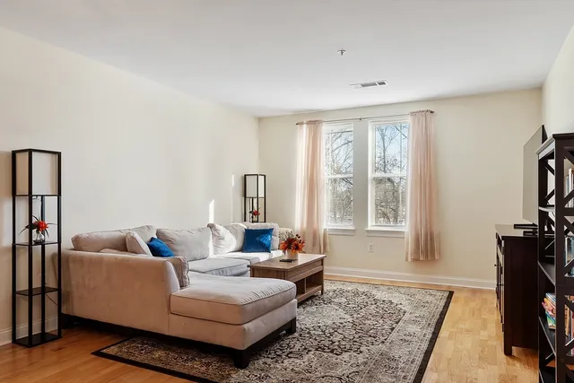a living room with furniture and a rug