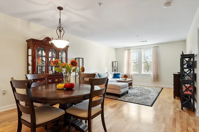a view of a dining room with furniture and window