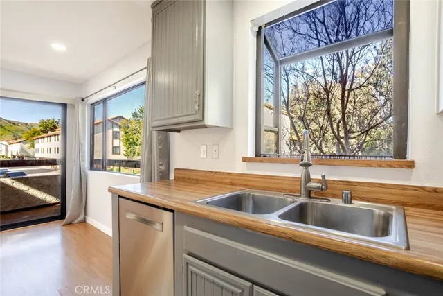 a kitchen that has a sink and a window