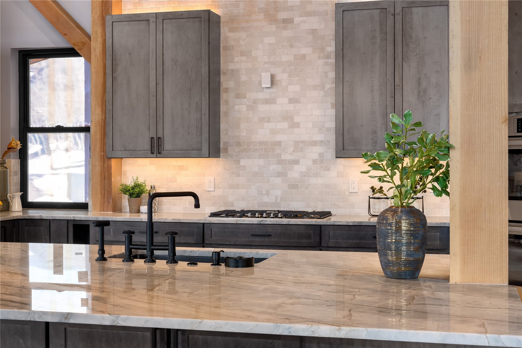 200 Sundance Court, Unit 1 Steamboat Springs, CO 80487 - Photo 14 of 50 Kitchen featuring light stone countertops and stainless steel gas stovetop