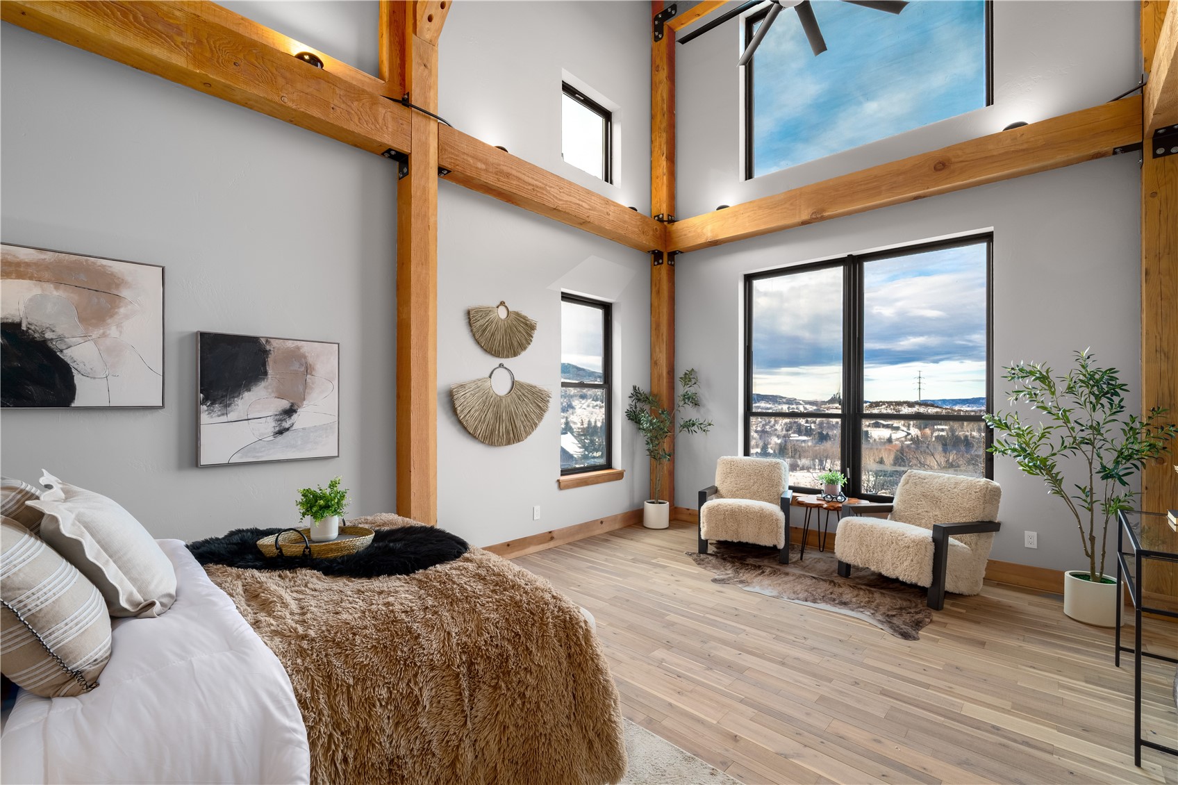 200 Sundance Court, Unit 1 Steamboat Springs, CO 80487 - Photo 16 of 50 Bedroom with hardwood / wood-style floors and a towering ceiling