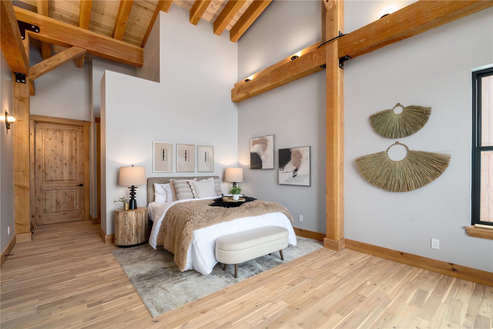 200 Sundance Court, Unit 1 Steamboat Springs, CO 80487 - Photo 17 of 50 Bedroom with high vaulted ceiling, light wood-style floors, and a wood ceiling with exposed beams