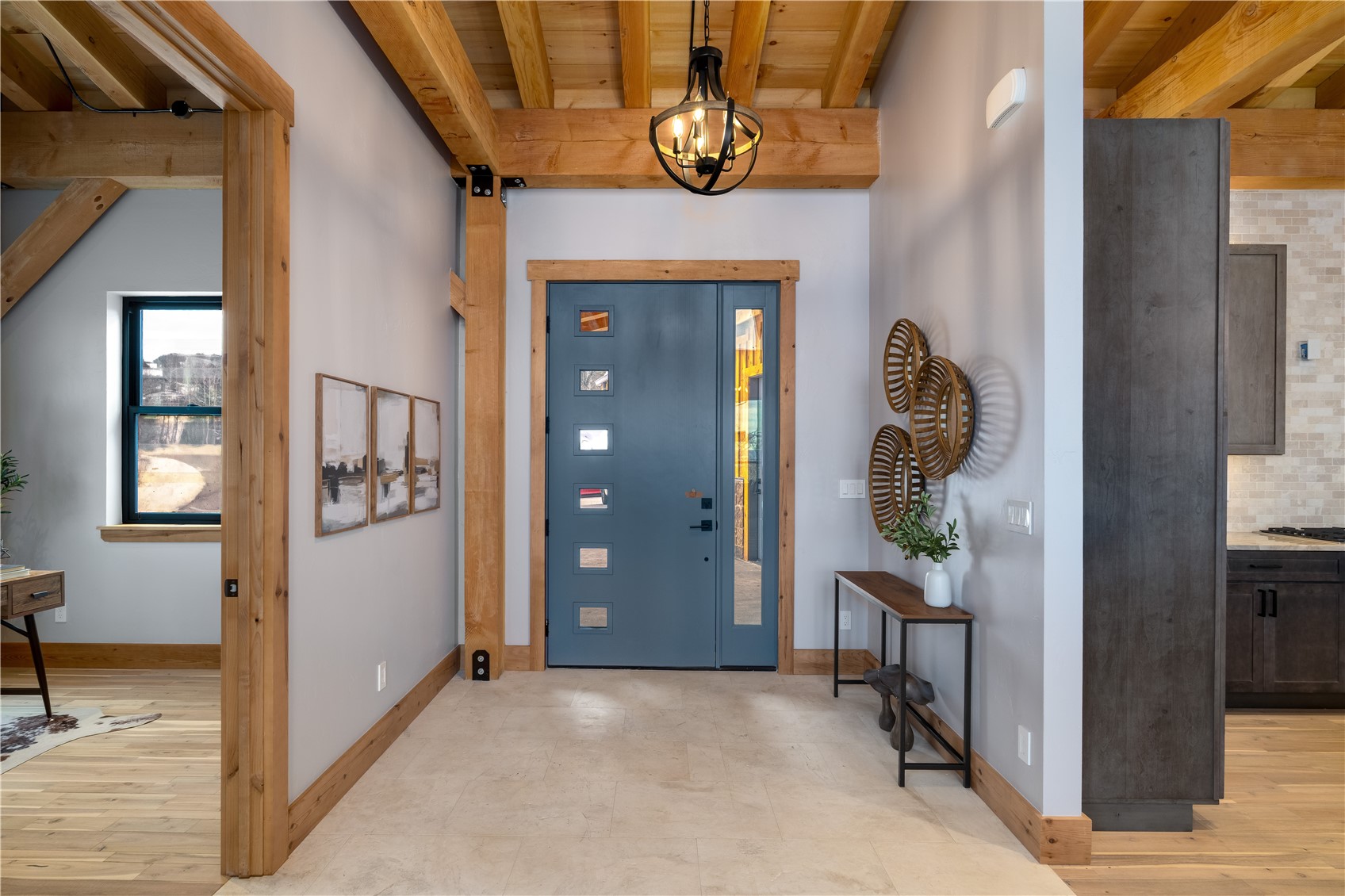 200 Sundance Court, Unit 1 Steamboat Springs, CO 80487 - Photo 21 of 50 Entryway with a wooden ceiling with exposed beams and a chandelier