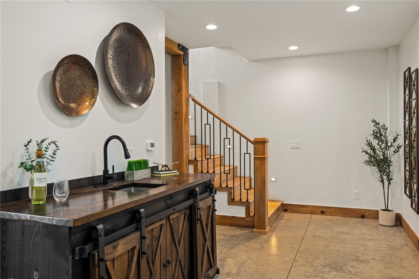 200 Sundance Court, Unit 1 Steamboat Springs, CO 80487 - Photo 23 of 50 Indoor wet bar featuring butcher block counters, recessed lighting, and stairs