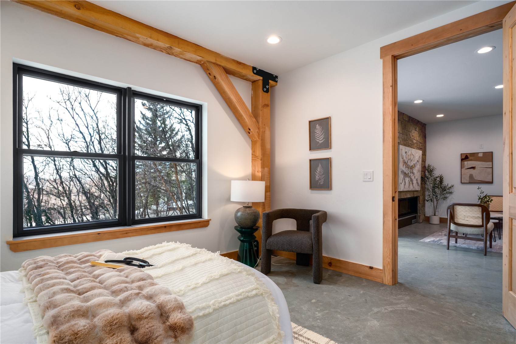 200 Sundance Court, Unit 1 Steamboat Springs, CO 80487 - Photo 33 of 50 Bedroom featuring concrete floors, recessed lighting, and a large fireplace
