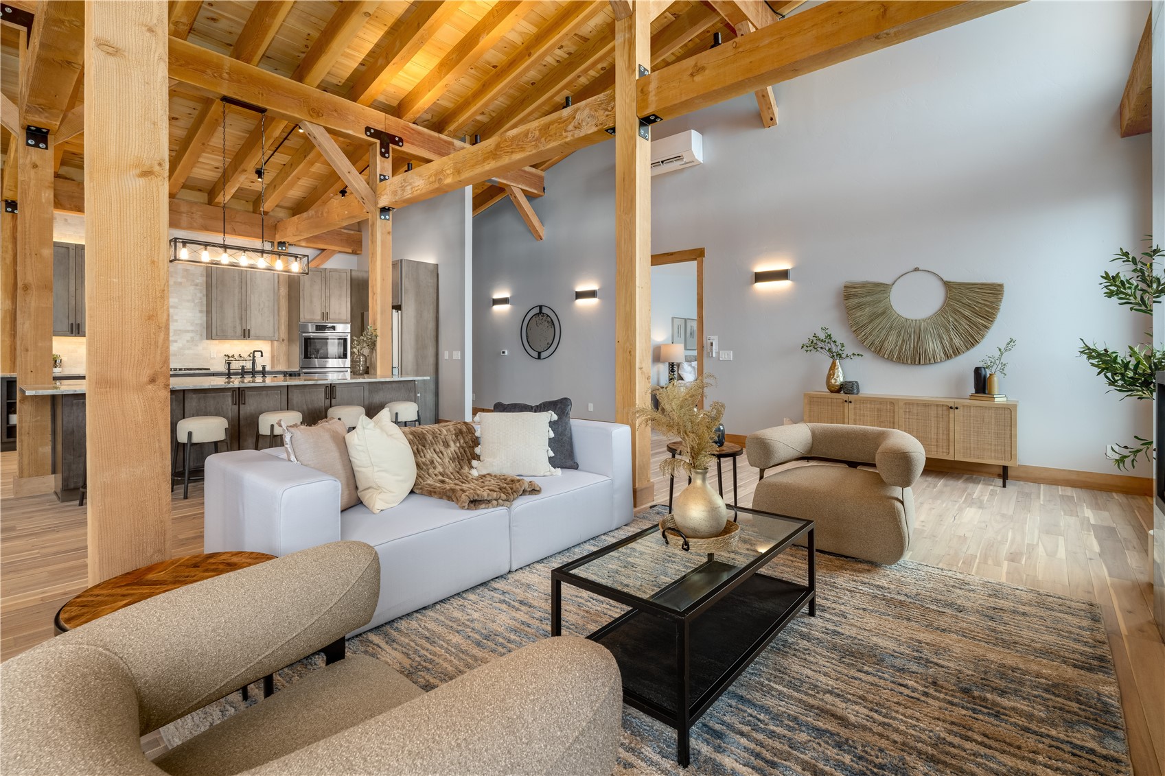 200 Sundance Court, Unit 1 Steamboat Springs, CO 80487 - Photo 7 of 50 Living room featuring light wood-style floors, high vaulted ceiling, and a wooden ceiling with exposed beams