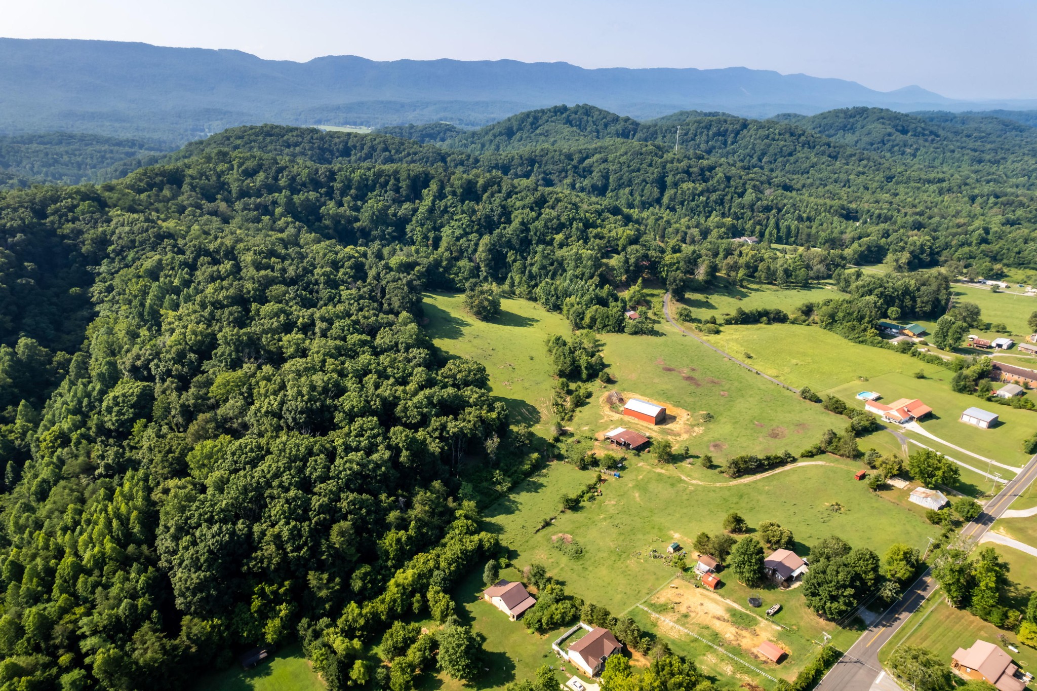 4 Blockhouse Road Maryville, TN 37803 - Photo 19 of 21 a view of a lush green hillside and a houses