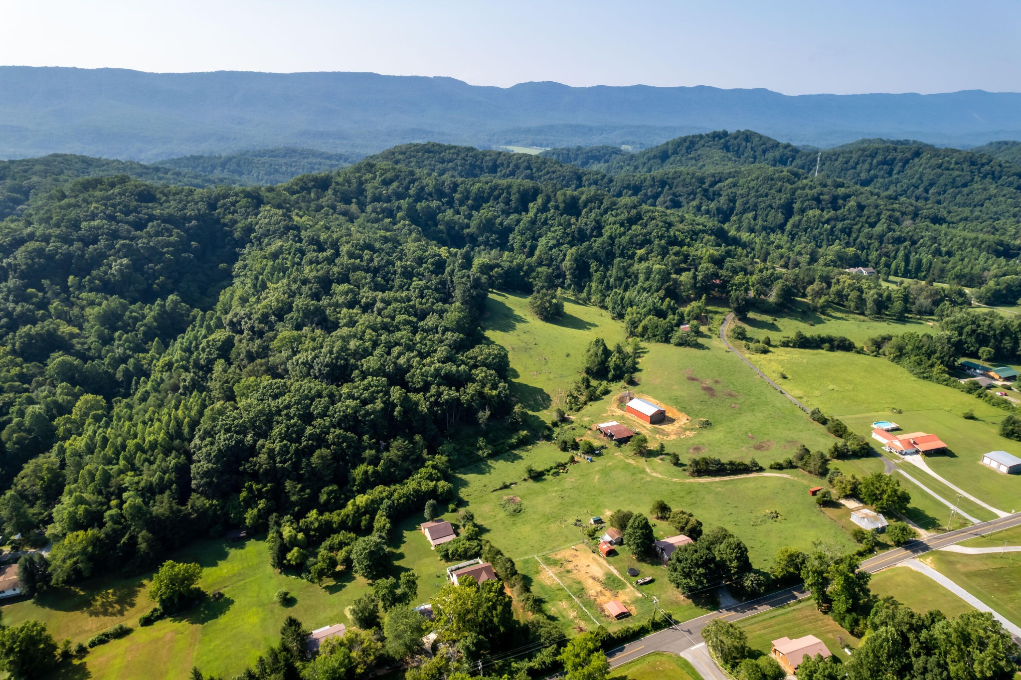 4 Blockhouse Road Maryville, TN 37803 - Photo 20 of 21 a view of a lush green hillside and a houses