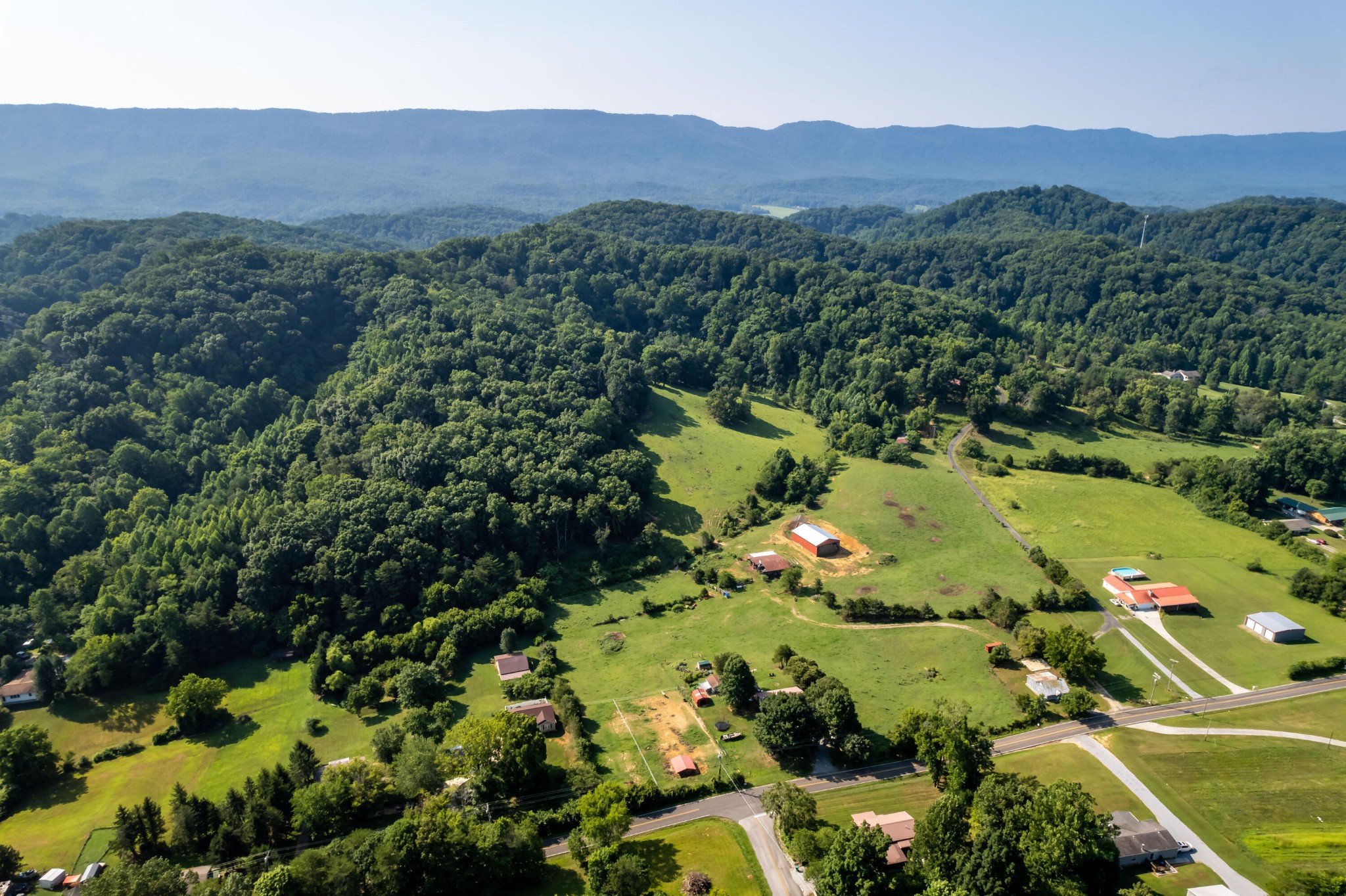 4 Blockhouse Road Maryville, TN 37803 - Photo 21 of 21 a view of a lush green hillside and a houses