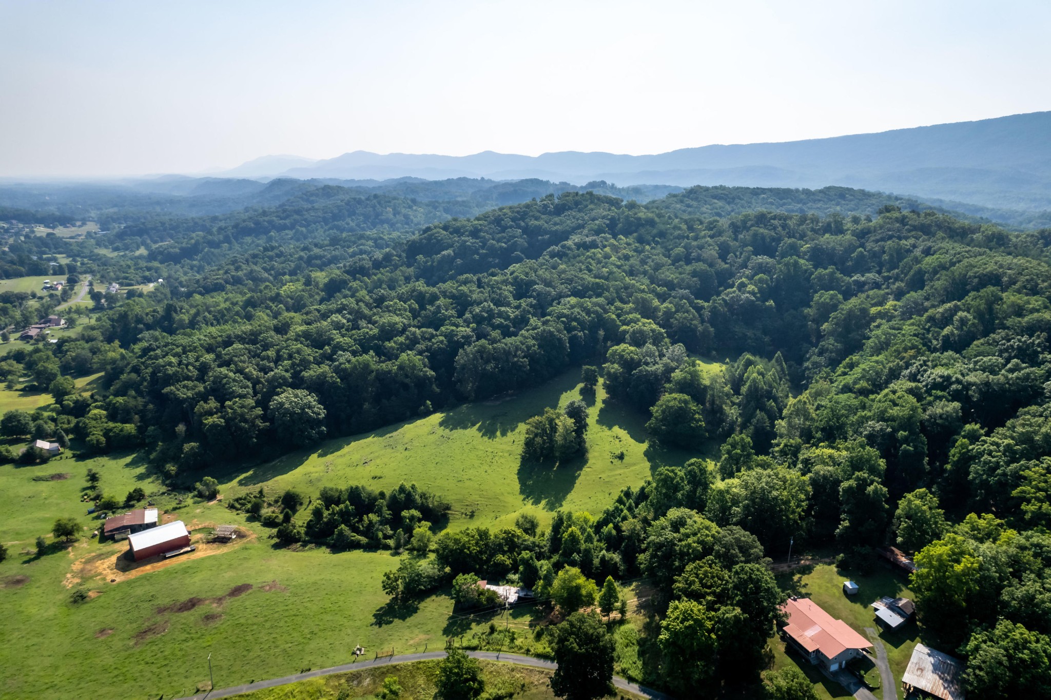 4 Blockhouse Road Maryville, TN 37803 - Photo 10 of 21 an aerial view of green landscape with trees houses and mountain view
