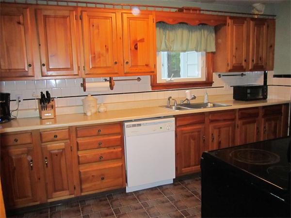 28 Martin Road Douglas, MA 01516 - Photo 11 of 28 a kitchen with stainless steel appliances granite countertop a sink stove and cabinets