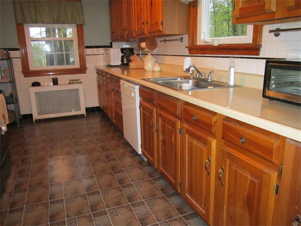 28 Martin Road Douglas, MA 01516 - Photo 12 of 28 a kitchen with stainless steel appliances a sink stove and cabinets