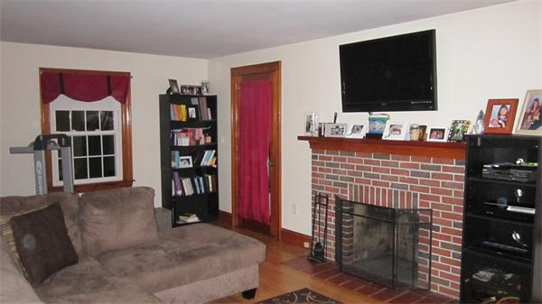28 Martin Road Douglas, MA 01516 - Photo 4 of 28 a living room with fireplace furniture and a flat screen tv