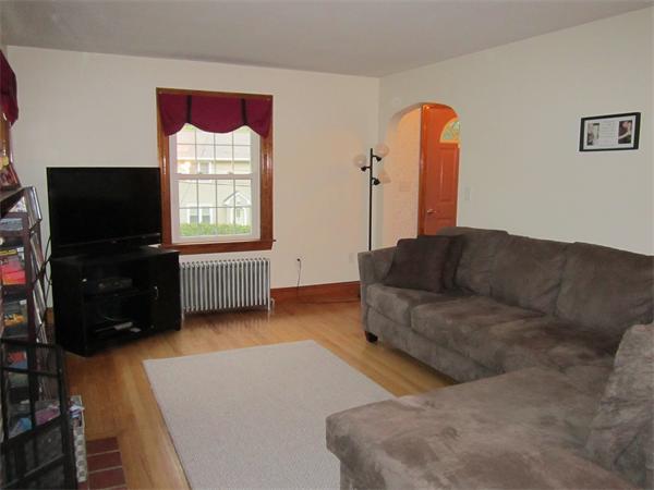 28 Martin Road Douglas, MA 01516 - Photo 8 of 28 a living room with furniture a flat screen tv and a window
