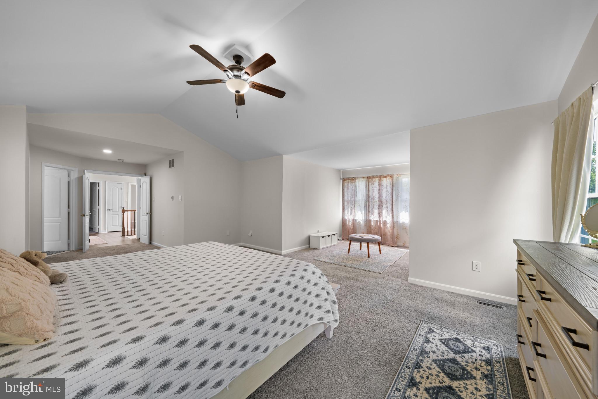 4132 Larson Lane Mount Airy, MD 21771 - Photo 22 of 36 a bedroom with a bed and a chandelier