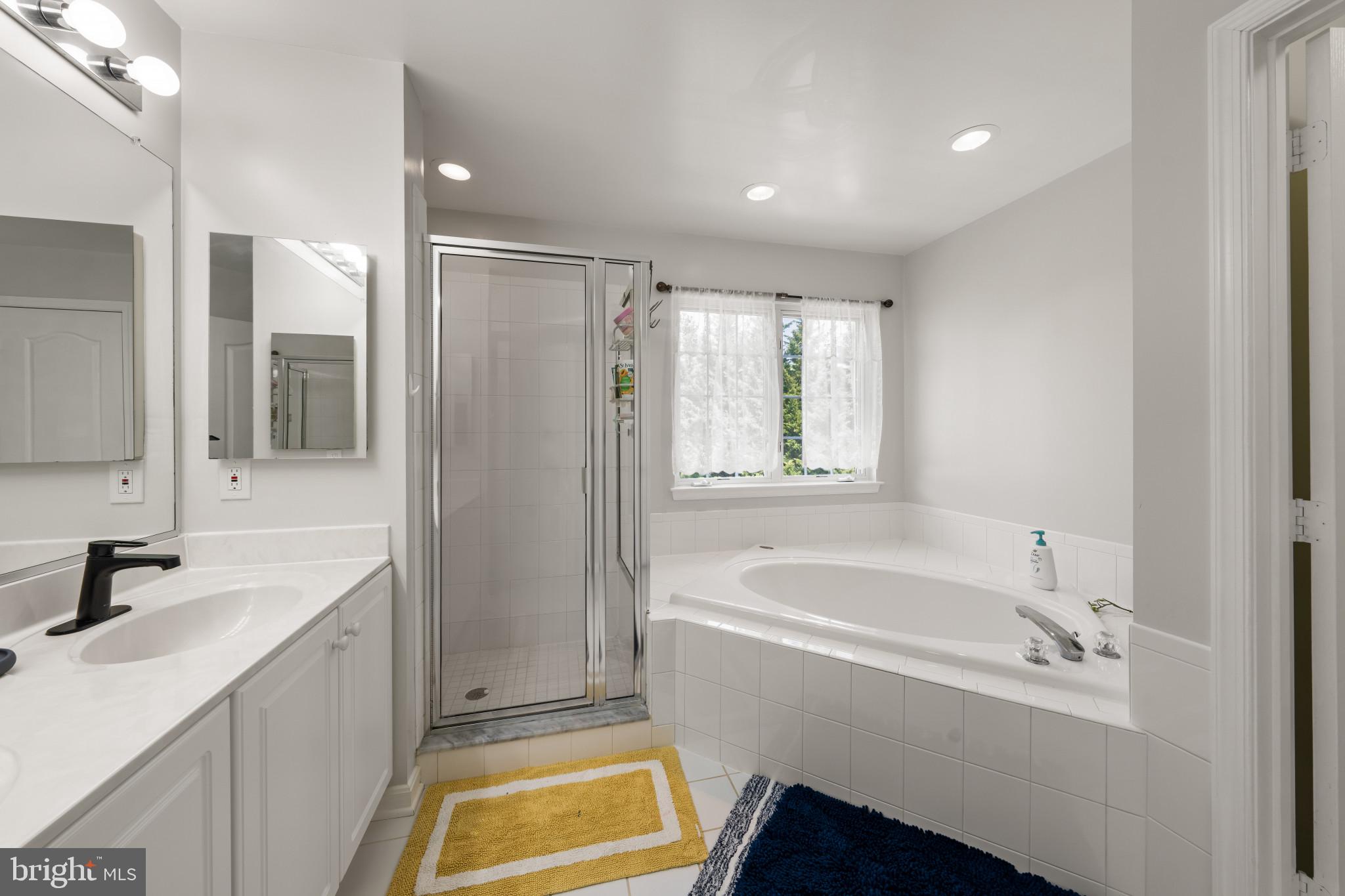 4132 Larson Lane Mount Airy, MD 21771 - Photo 24 of 36 a bathroom with a tub sink and mirror