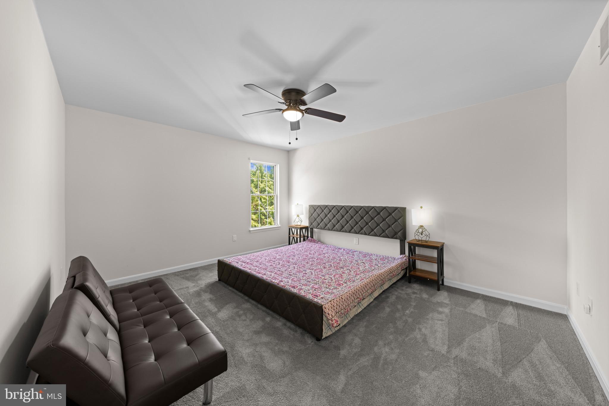 4132 Larson Lane Mount Airy, MD 21771 - Photo 29 of 36 a bedroom with a bed and a chandelier