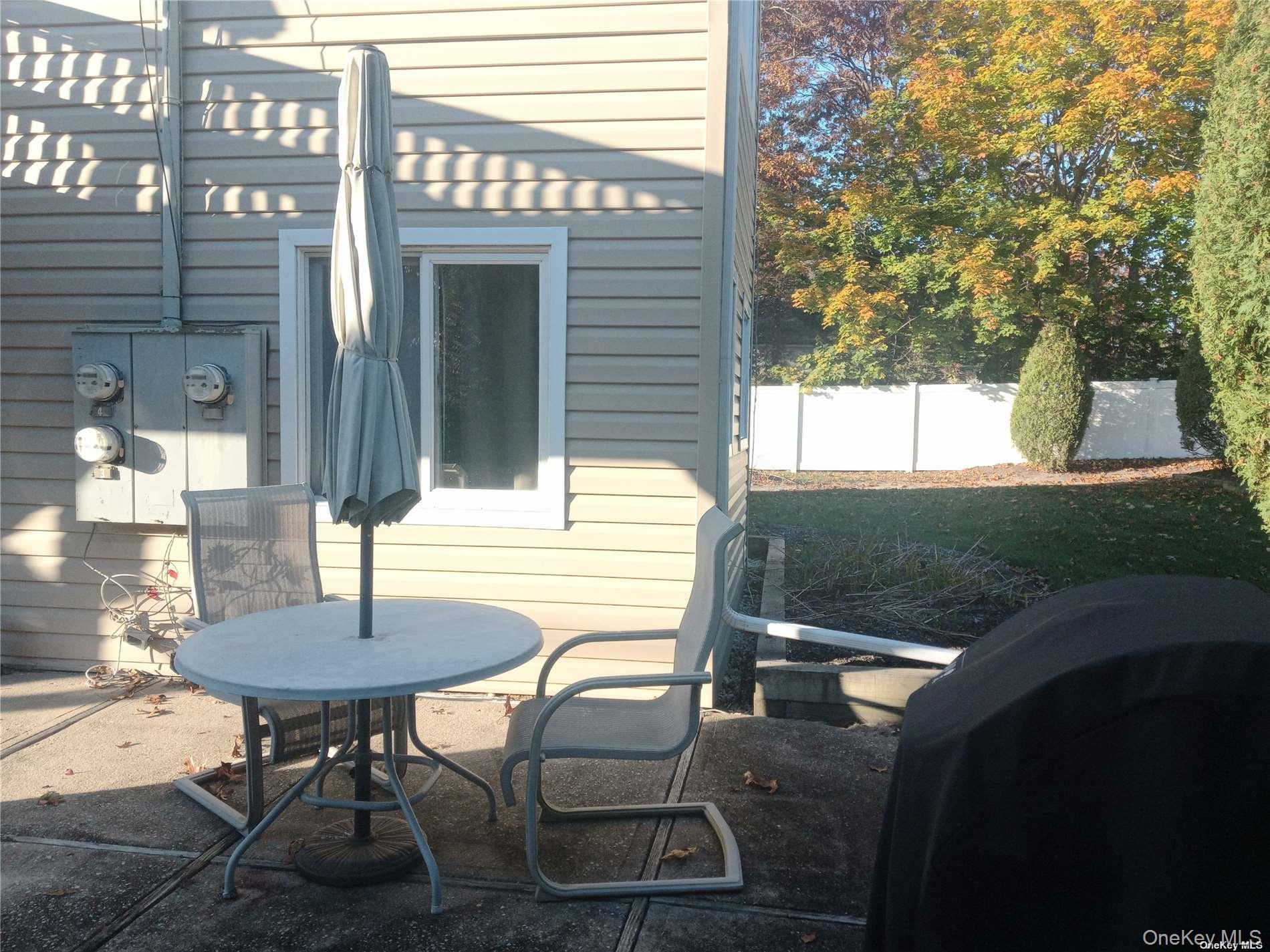 95 Springville Road South, Unit 3 Hampton Bays, NY 11946 - Photo 11 of 17 a view of a outdoor seating area