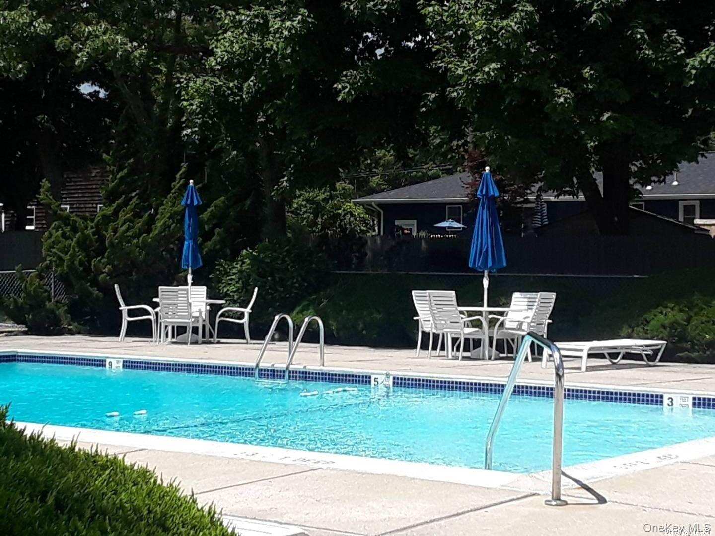 95 Springville Road South, Unit 3 Hampton Bays, NY 11946 - Photo 12 of 17 a view of a chairs and table in the garden