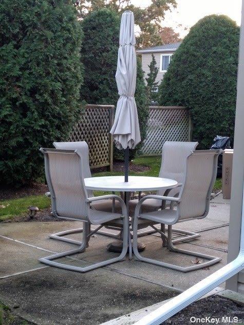 95 Springville Road South, Unit 3 Hampton Bays, NY 11946 - Photo 10 of 17 a view of backyard with sitting area