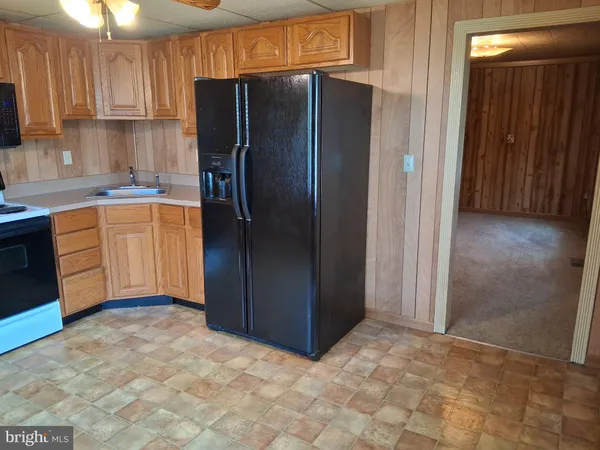 a view of a storage room with water heater and racks