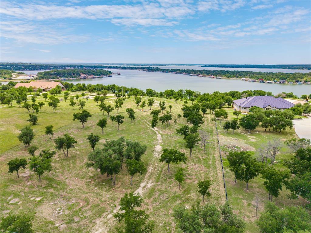 977 Deep Water Road May, TX 76857 - Photo 2 of 36 a view of a lake with a big yard