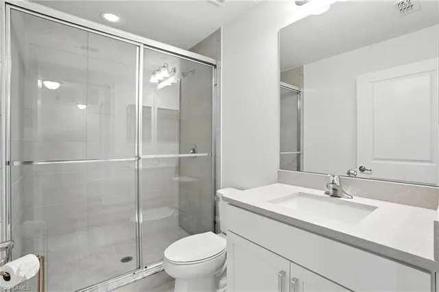 a view of a pathway with a flower garden