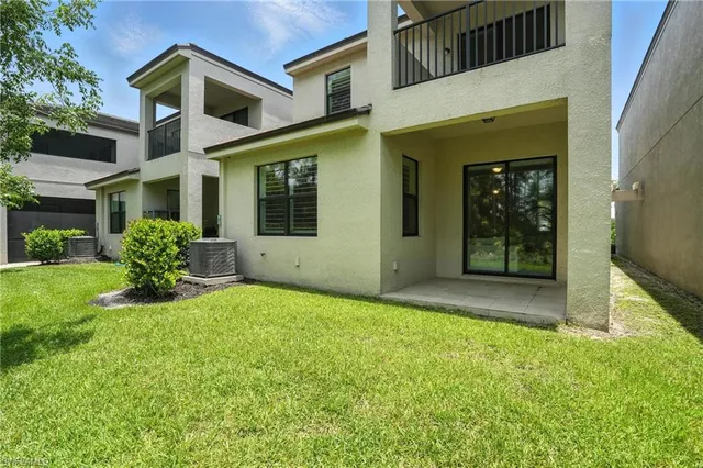 an aerial view of a house with outdoor space and street view