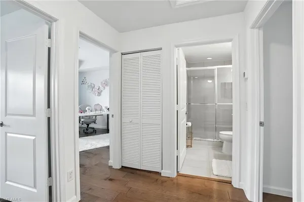 a bathroom with a glass shower door