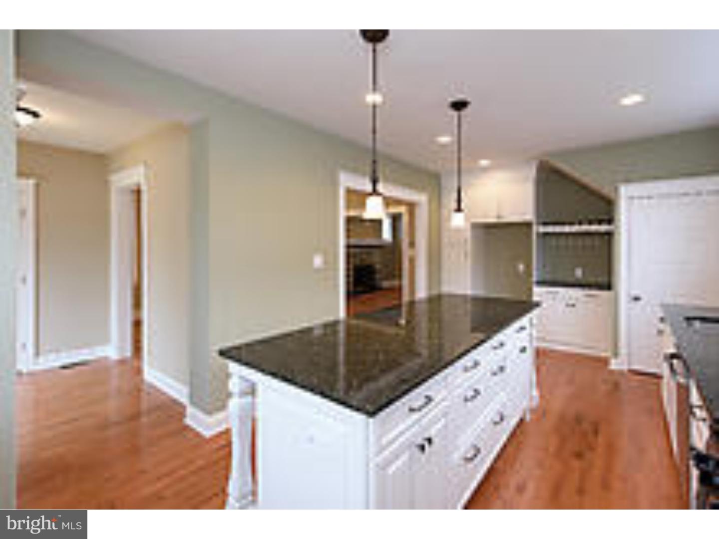 131 South Rolling Road Springfield, PA 19064 - Photo 12 of 25 a kitchen with granite countertop a sink a counter top space and cabinets