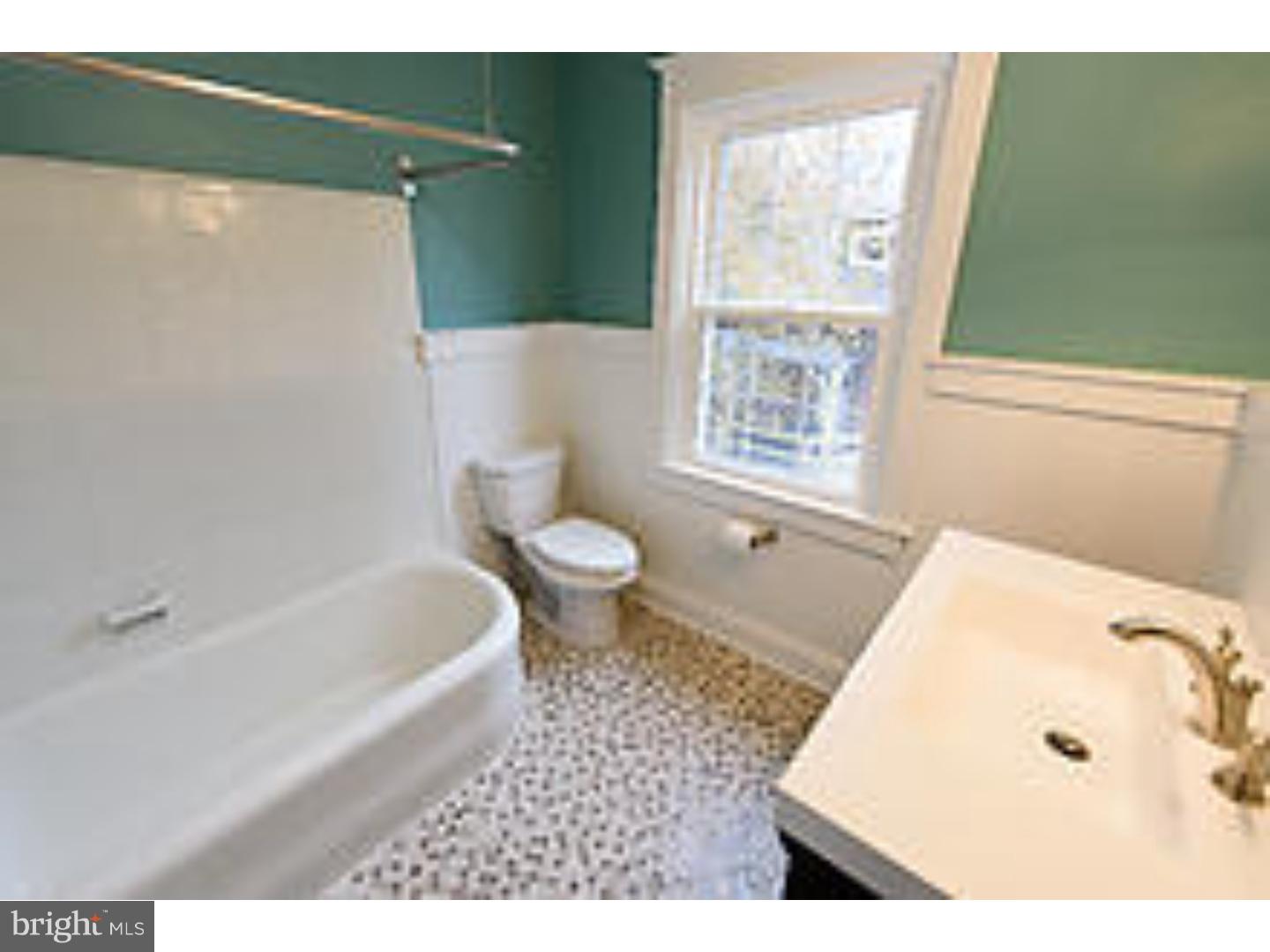 131 South Rolling Road Springfield, PA 19064 - Photo 15 of 25 a bathroom with a sink a toilet and a bathtub
