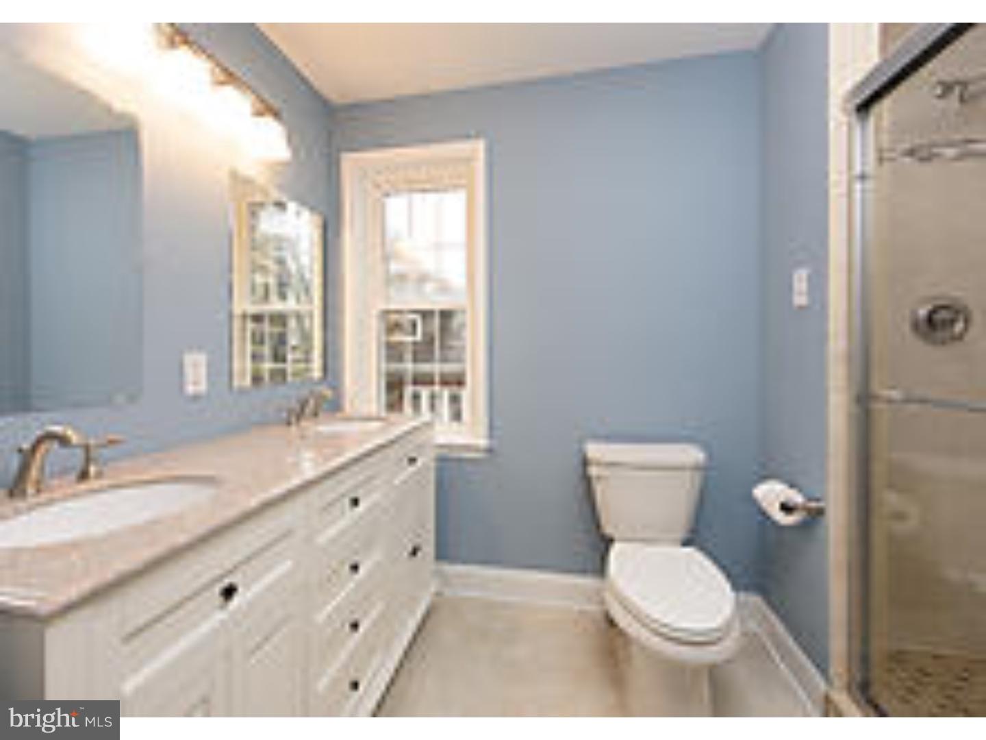 131 South Rolling Road Springfield, PA 19064 - Photo 20 of 25 a bathroom with a granite countertop toilet sink and mirror