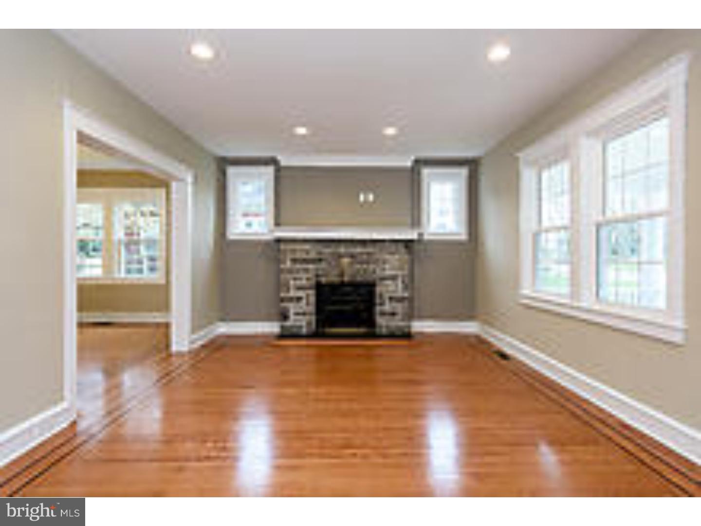 131 South Rolling Road Springfield, PA 19064 - Photo 3 of 25 a view of an empty room with a window and fireplace