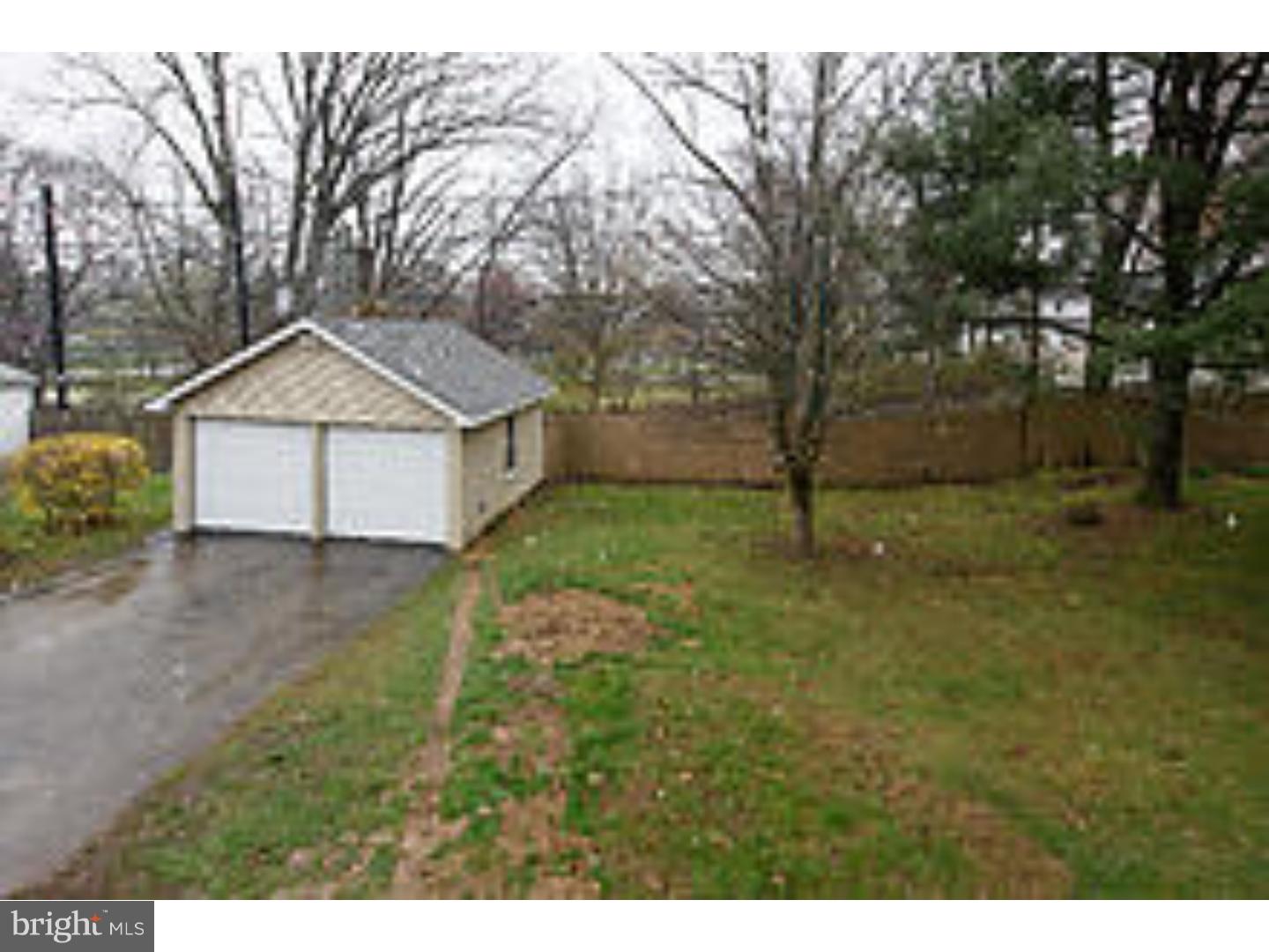 131 South Rolling Road Springfield, PA 19064 - Photo 23 of 25 a front view of a house with a yard and garage