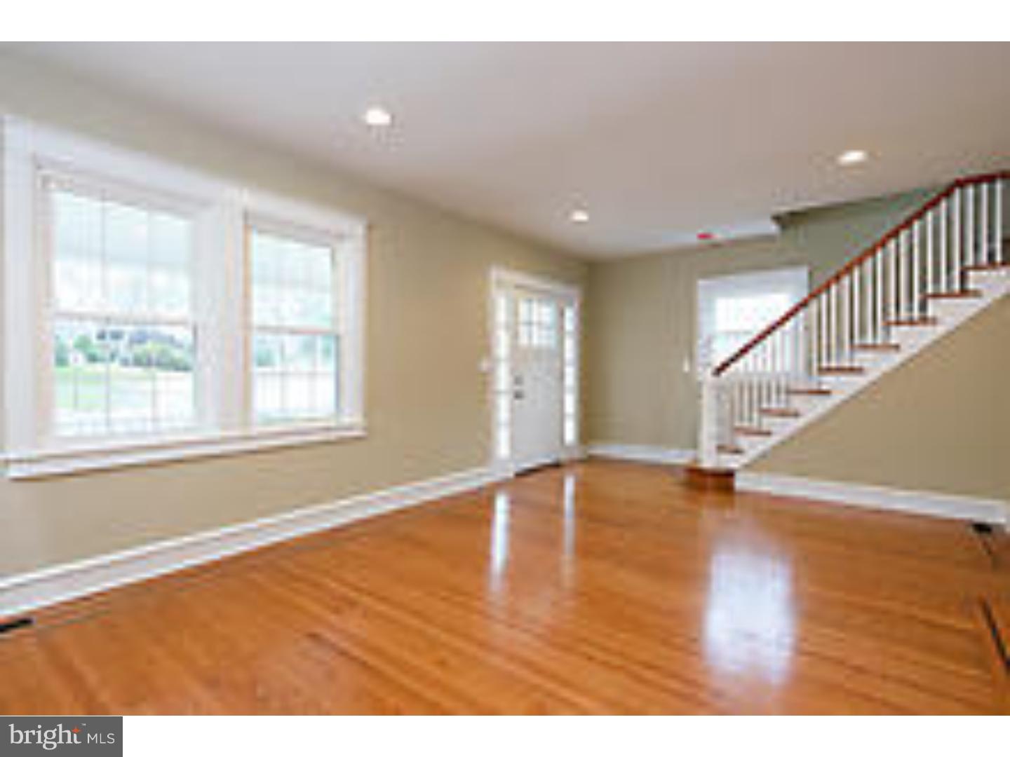131 South Rolling Road Springfield, PA 19064 - Photo 4 of 25 a view of an empty room with wooden floor and a window
