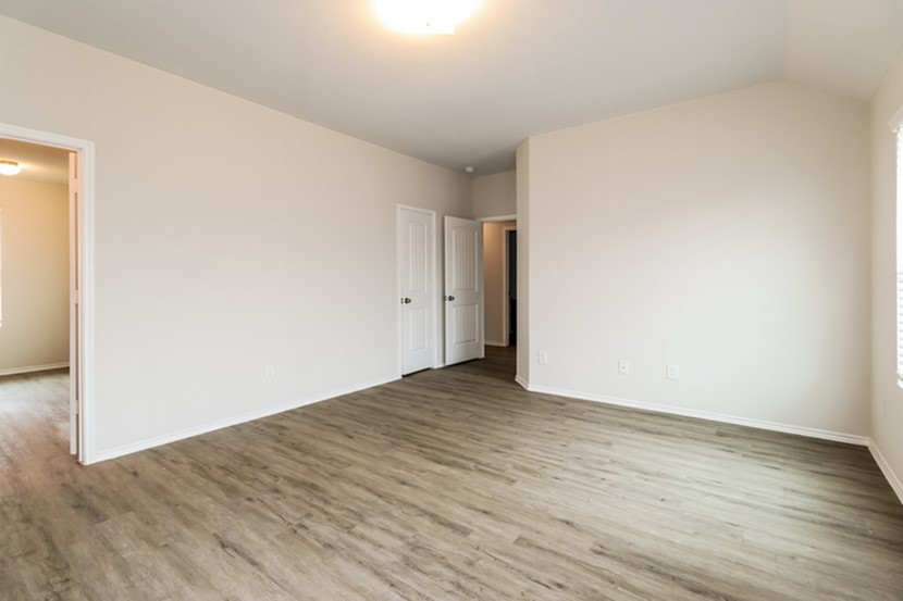 3765 Alexus Drive Conroe, TX 77301 - Photo 12 of 19 a view of an empty room with wooden floor