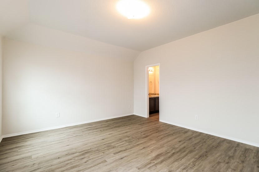 3765 Alexus Drive Conroe, TX 77301 - Photo 13 of 19 a view of an empty room and wooden floor