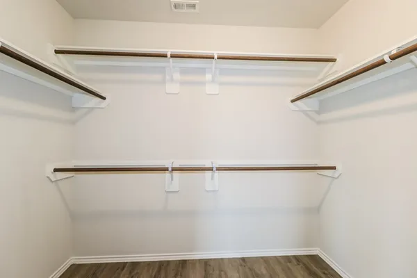 a view of a room with racks on the wall