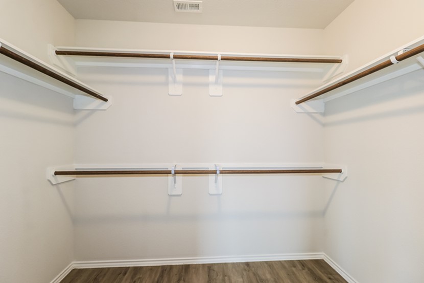 3765 Alexus Drive Conroe, TX 77301 - Photo 14 of 19 a view of a room with racks on the wall
