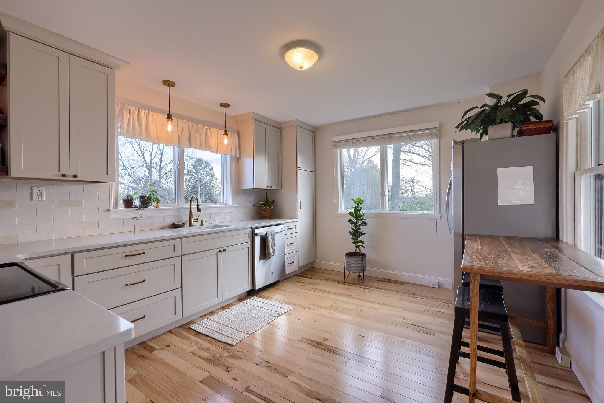 770 Mohns Hill Road Reading, PA 19608 - Photo 19 of 53 a kitchen with a table chairs sink and cabinets