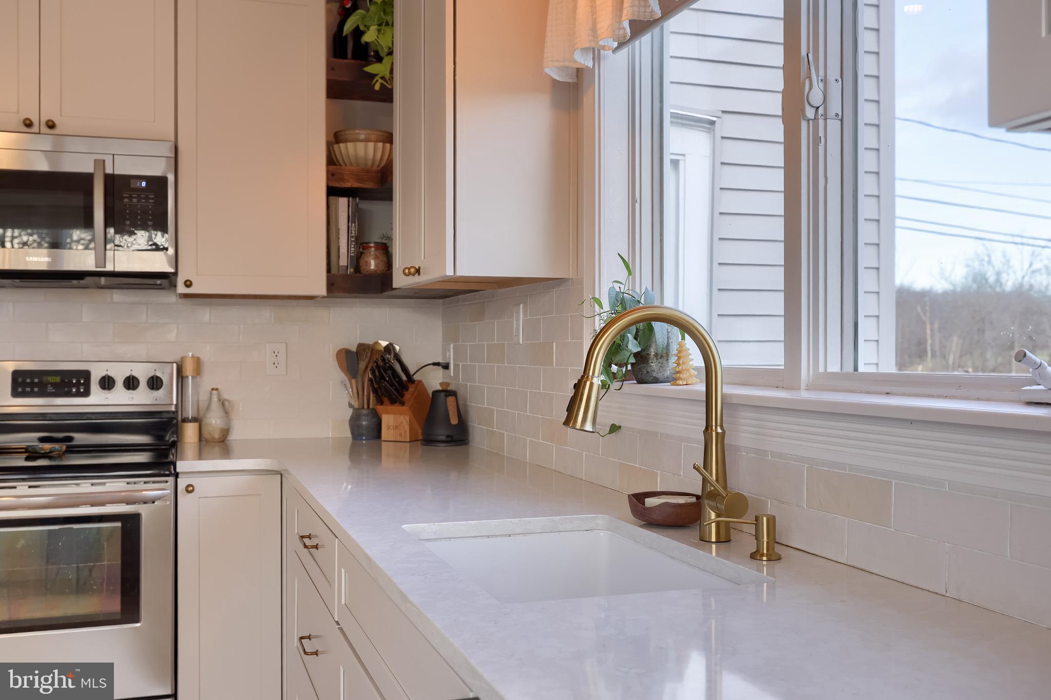 770 Mohns Hill Road Reading, PA 19608 - Photo 21 of 53 a kitchen with a sink and a stove top oven