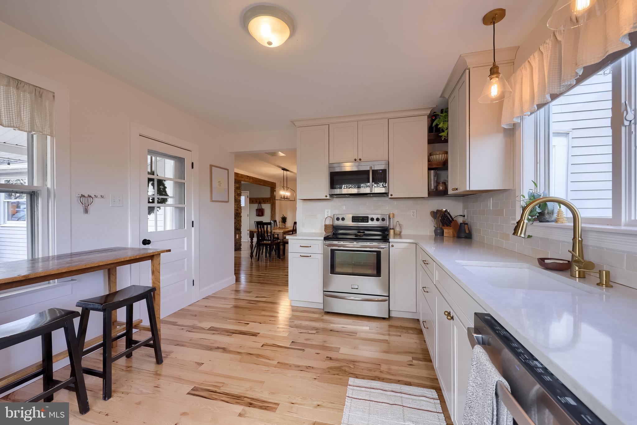 770 Mohns Hill Road Reading, PA 19608 - Photo 23 of 53 a kitchen with kitchen island granite countertop a sink cabinets and stainless steel appliances