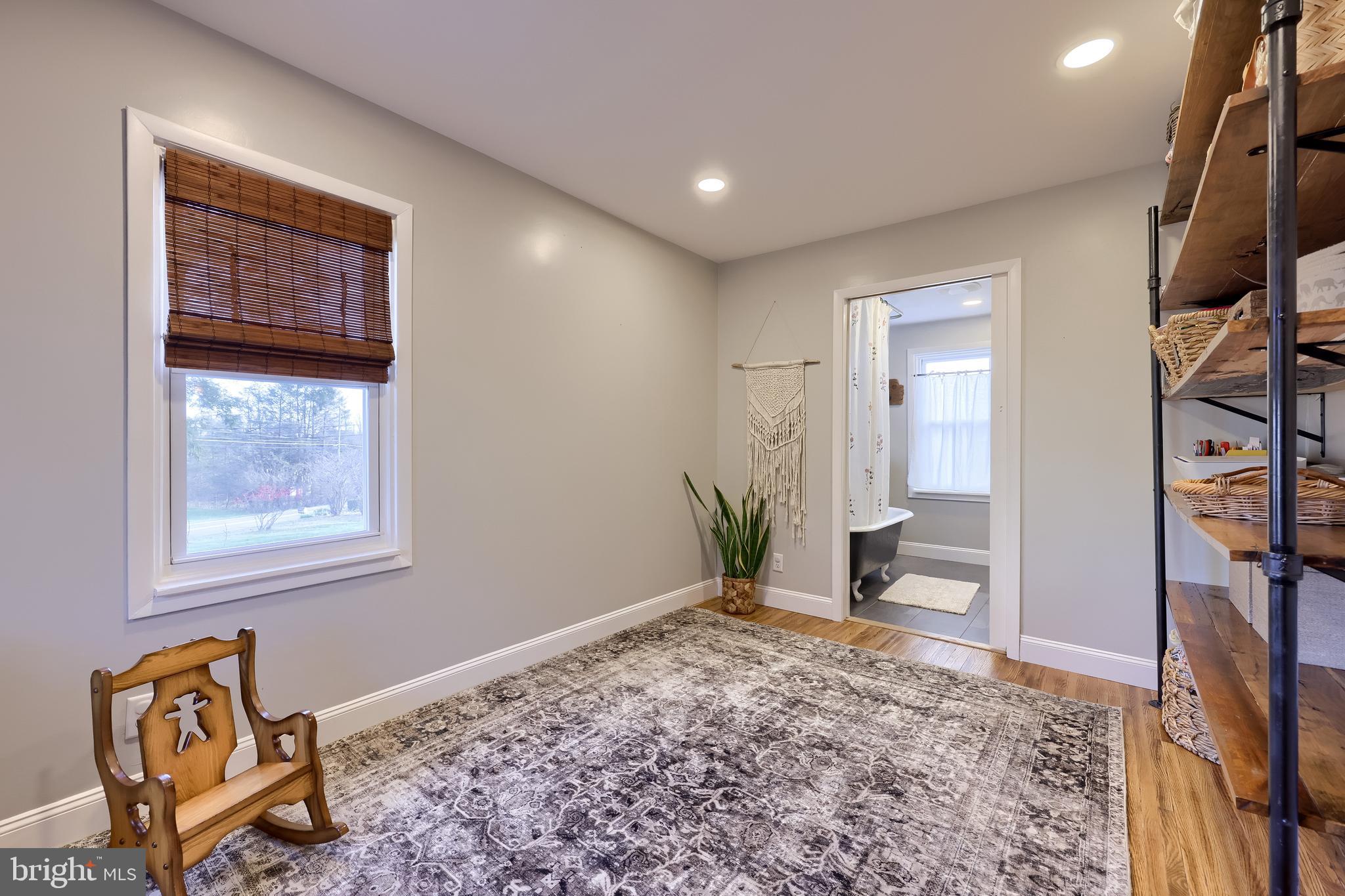 770 Mohns Hill Road Reading, PA 19608 - Photo 25 of 53 a view of an empty room with a fireplace and a window