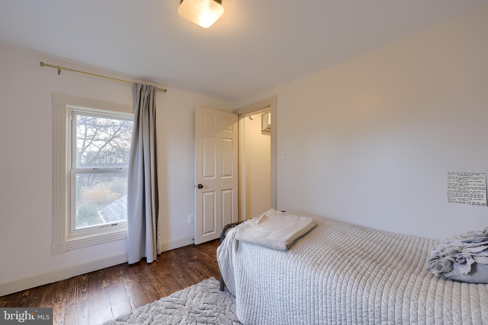 770 Mohns Hill Road Reading, PA 19608 - Photo 30 of 53 a bedroom with a bed and wooden floor