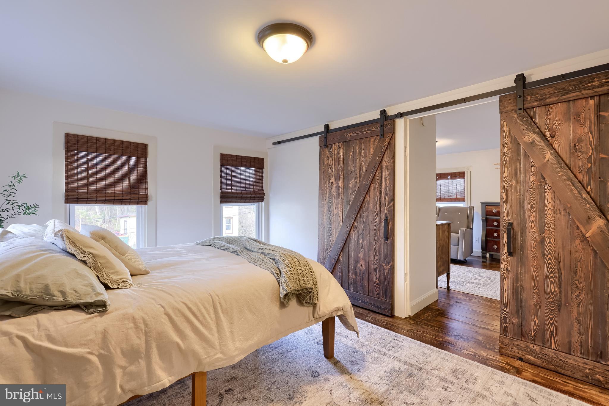 770 Mohns Hill Road Reading, PA 19608 - Photo 33 of 53 a bedroom with a bed and a mirror